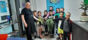 The children from the Afterschools club donating their first harvest to Southill Hub chef Bernard